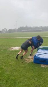 Rugby player completing contact preparation exercises